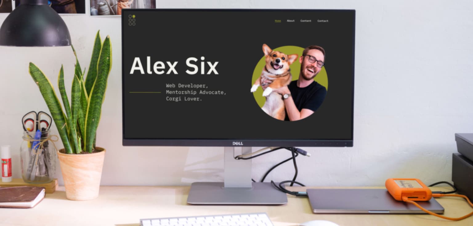 My new website on an external monitor, sitting on a desk